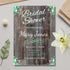 Bridal shower invitation with wooden planks design on a light gray surface with decorative elements.